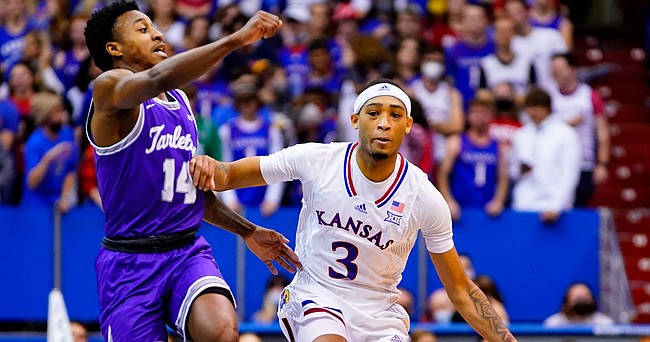 Kansas guard Dajuan Harris (3) charges down the court against Tarleton State guard Javontae Hopkins (14) during the second half on Friday, Nov. 12, 2021 at Allen Fieldhouse.