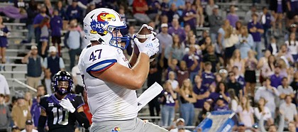 Kansas fullback Jared Casey catches a touchdown pass in front of TCU linebacker Dee Winters during the second half of a game on Nov. 20, 2021, in Fort Worth, Texas.