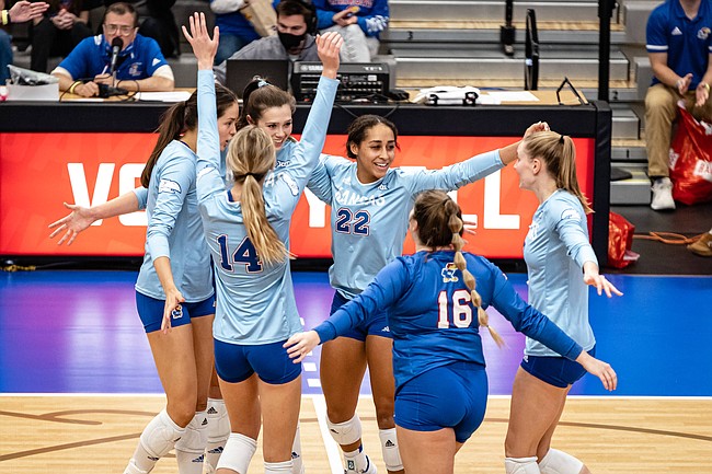 The Jayhawks celebrate a point their four-set win over Oklahoma on Saturday, Oct. 30, 2021 at Horejsi Family Volleyball Arena. 