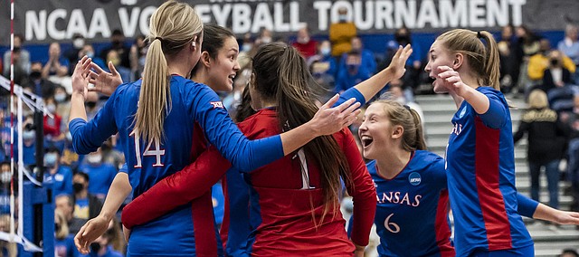 Members of the Kansas volleyball team come together during the Jayhawks' Sweet 16 match at Pitt, on Dec. 9, 2021, in Pittsburgh, Pennsylvania.