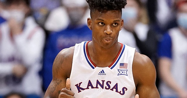 Kansas forward K.J. Adams (24) gives a thumbs up to the bench after stuffing an Iowa State shot during the second half on Tuesday, Jan. 11, 2022 at Allen Fieldhouse.
