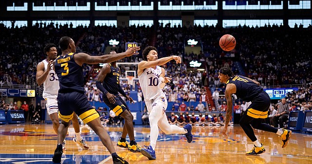 Kansas forward Jalen Wilson (10) throws a pass to the wing against West Virginia during the second half on Saturday, Jan. 15, 2022 at Allen Fieldhouse.