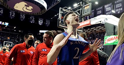 Kansas guard Christian Braun (2) pops his jersey and he and the Jayhawks leave the court following their 78-75 win over Kansas State on Saturday, Jan. 22, 2022 at Bramlage Coliseum.