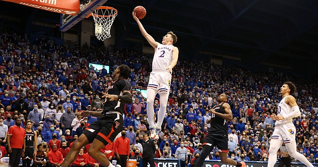 Kansas guard Christian Braun (2) floats in for a bucket against Texas Tech Red during the first half on Monday, Jan. 24, 2022 at Allen Fieldhouse.