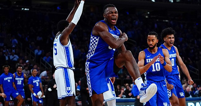 Kentucky's Oscar Tshiebwe (34) reacts after scoring during the second half of an NCAA college basketball game against Duke Tuesday, Nov. 9, 2021, in New York. Duke won 79-71. (AP Photo/Frank Franklin II)