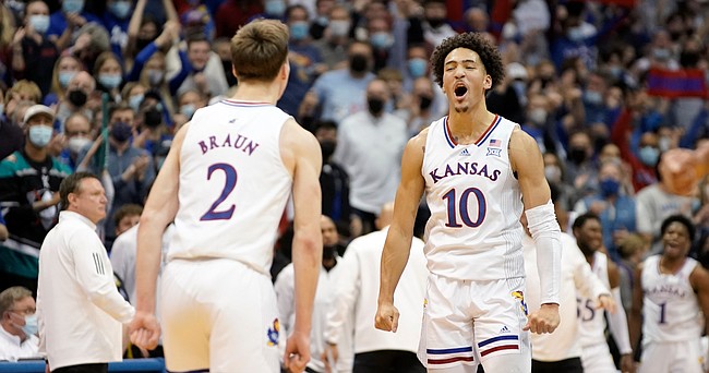 Kansas forward Jalen Wilson (10) celebrates with Kansas guard Christian Braun (2) after a dunk by Braun against Baylor during the first half on Saturday, Feb. 5, 2022 at Allen Fieldhouse.