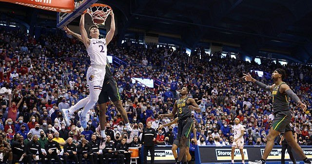 Kansas guard Christian Braun (2) comes in for a dunk against Baylor during the first half on Saturday, Feb. 5, 2022 at Allen Fieldhouse.