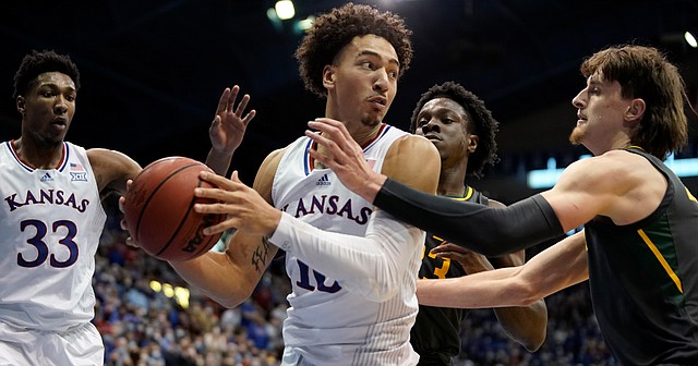 Kansas forward Jalen Wilson (10) looks to dish to the wing against Baylor during the second half on Saturday, Feb. 5, 2022 at Allen Fieldhouse.