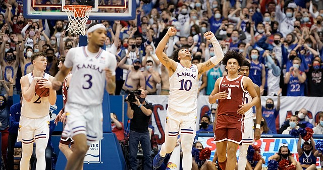 Kansas forward Jalen Wilson (10) raises his fists in celebration as the Jayhawks narrowly escaped with a 71-69 victory over Oklahoma on Saturday, Feb. 12, 2022 at Allen Fieldhouse.