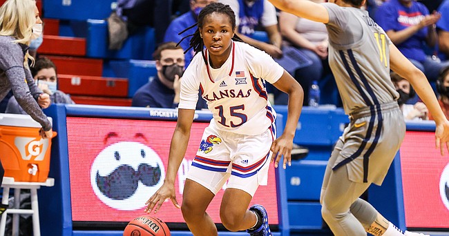 Kansas guard Zakiyah Franklin puts the ball down and drives to the basket during the Jayhawks' home game against West Virginia on Tuesday, Feb. 15, 2022 at Allen Fieldhouse. 
