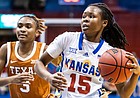 Kansas guard Zakiyah Franklin blows by a Texas defender during KU's home loss to the Longhorns on Wednesday, March 2, 2022 at Allen Fieldhouse. 