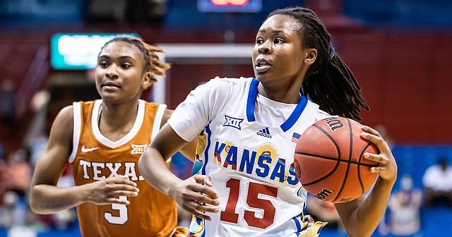 Kansas guard Zakiyah Franklin blows by a Texas defender during KU's home loss to the Longhorns on Wednesday, March 2, 2022 at Allen Fieldhouse. 
