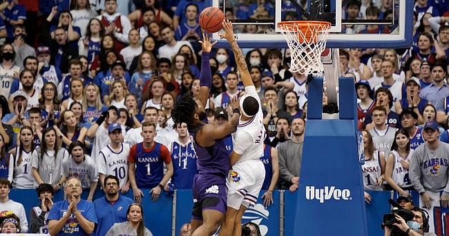 Kansas guard Dajuan Harris Jr. (3) gets up to get a hand on a final shot from TCU guard Mike Miles (1) with seconds remaining in the second half on Tuesday, March 3, 2022 at Allen Fieldhouse.