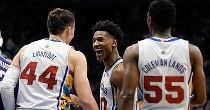 Kansas guard Ochai Agbaji (30) celebrates with Kansas forward Mitch Lightfoot (44) after a dunk by Lightfoot against Kansas State during the second half on Tuesday, Feb. 22, 2022 at Allen Fieldhouse.