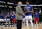 Kansas guard Ochai Agbaji receives the Big 12 Player of the Year trophy from commissioner Bob Bowlsby prior to tipoff against West Virginia on Thursday, March 10, 2022 at T-Mobile Center in Kansas City.