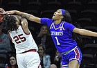 Kansas women's basketball player Taiyanna Jackson, right, blocks a shot by Oklahoma's Mady Williams during the Big 12 quarterfinal game against Oklahoma at Municipal Auditorium in Kansas City, Missouri, on March 11, 2022.