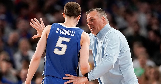 Creighton head coach Greg McDermott talks with Creighton guard Alex O'Connell (5) during a break in action in the second half on Thursday, March 17, 2022 at Dickies Arena in Fort Worth, Texas.