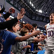 A sea of hands reach out to slap hands with Kansas forward Jalen Wilson (10) and the Jayhawks as they leave the court following their win over Creighton on Saturday, March 19, 2022 at Dickies Arena in Fort Worth, Texas. The Jayhawks advanced to the Sweet 16 with a 79-72 win over the Bluejays.