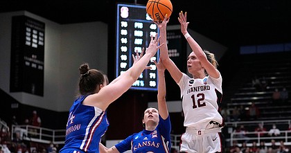 Stanford guard Lexie Hull (12) shoots over Kansas center Danai Papadopoulou (14) and guard Holly Kersgieter (13) during the second half of a second-round game in the NCAA women's college basketball tournament Sunday, March 20, 2022, in Stanford, Calif. (AP Photo/Tony Avelar)



