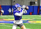 Kansas wide receiver Lawrence Arnold catches a pass during a drill at the Indoor Practice Field on March 22, 2022.