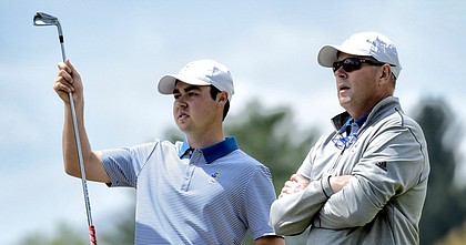 Kansas golf coach Jamie Bermel, right, advises Ben Sigel during the Big 12 men's golf championships at The Greenbrier in White Sulphur Springs, W.Va., on April 25, 2019.