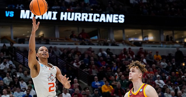 Miami’s Isaiah Wong shoots in front of Iowa State's Aljaz Kunc during the second half of a college basketball game in the Sweet 16 round of the NCAA tournament Friday, March 25, 2022, in Chicago.