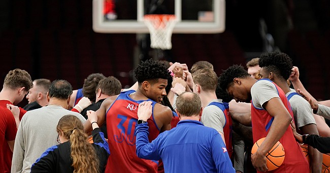 Kansas guard Ochai Agbaji (30) and the Jayhawks lean in for a team huddle during practice on Thursday, March 24, 2022 at United Center in Chicago.