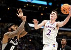Kansas guard Christian Braun (2) comes inside for a shot against Providence center Nate Watson (0) during the first half on Friday, March 25, 2022 at United Center in Chicago.