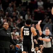 Kansas forward Jalen Wilson (10) pumps his fist as the Jayhawks take control late in the second half against Providence on Friday, March 25, 2022 at United Center in Chicago. The Jayhawks defeated the Friars, 66-61.