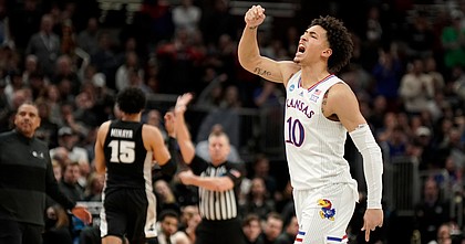 Kansas forward Jalen Wilson (10) pumps his fist as the Jayhawks take control late in the second half against Providence on Friday, March 25, 2022 at United Center in Chicago. The Jayhawks defeated the Friars, 66-61.