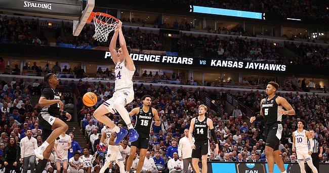 Kansas forward Mitch Lightfoot (44) delivers a dunk against Providence during the second half on Friday, March 25, 2022 at United Center in Chicago.