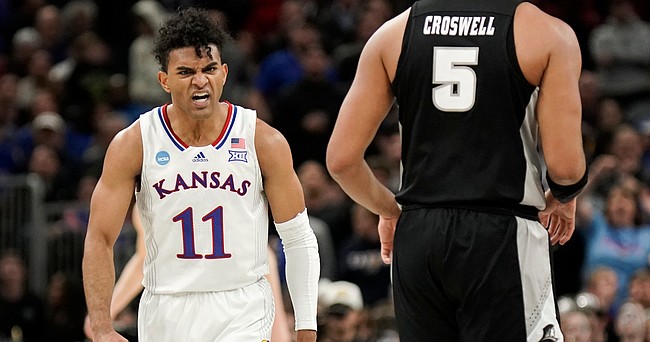Kansas guard Remy Martin (11) gets fired up as the Jayhawks take control late in the second half on Friday, March 25, 2022 at United Center in Chicago.