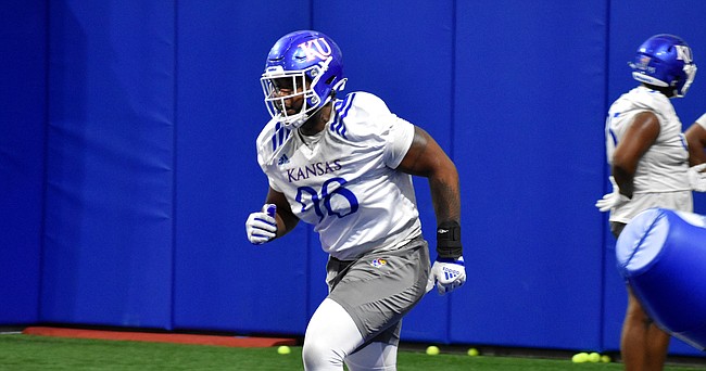 Kansas defensive tackle Caleb Sampson completes a drill during spring practice on March 22, 2022.
