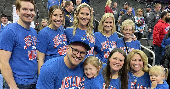 Margaret Self, back right, the mother of Kansas basketball coach Bill Self, poses for a group photo with her family during a recent Kansas postseason game. After the passing of Self's father in late January, Margaret has been able to become a fixture behind the KU bench again, and she'll be in New Orleans this weekend when the Jayhawks play in the 2022 Final Four. 