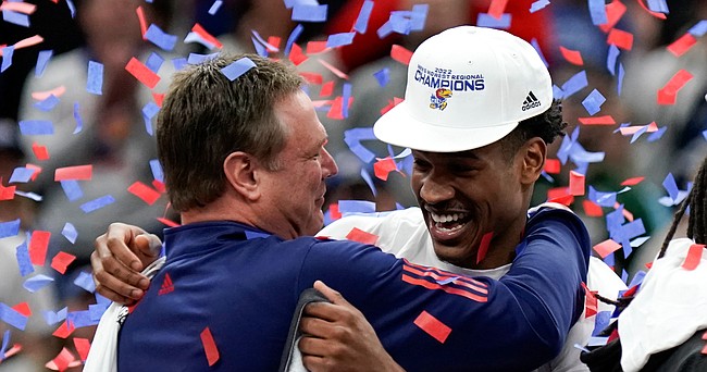 Kansas head coach Bill Self hugs Kansas guard Ochai Agbaji as the Jayhawks celebrate after defeating Miami, 76-50 to advance to the Final Four on Sunday, March 27, 2022 at United Center in Chicago.
