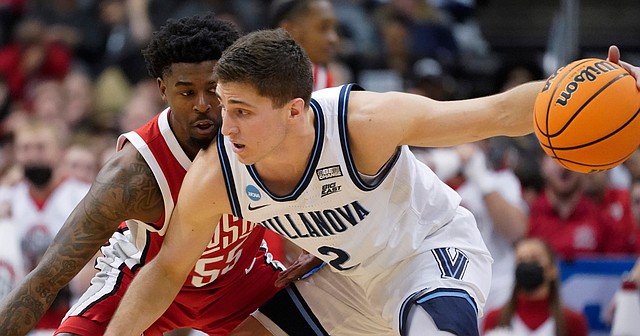 Villanova's Collin Gillespie tries to get past Ohio State's Jamari Wheeler during the first half of a second-round NCAA Tournament game in Pittsburgh on March 20, 2022.