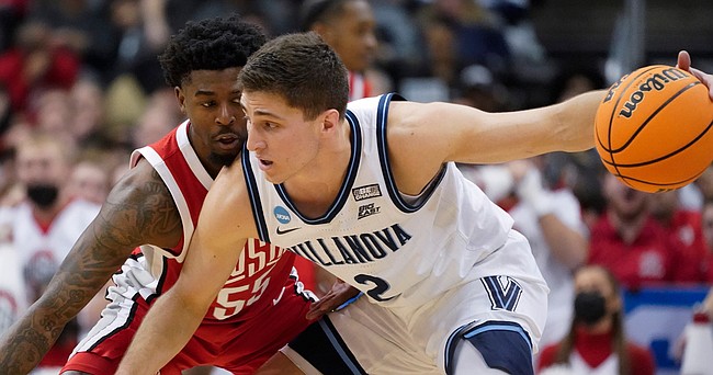 Villanova's Collin Gillespie tries to get past Ohio State's Jamari Wheeler during the first half of a second-round NCAA Tournament game in Pittsburgh on March 20, 2022.