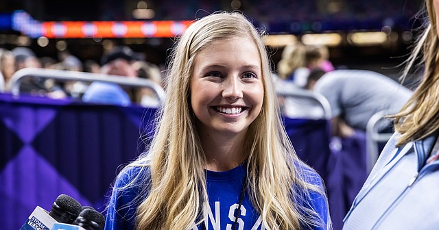 Kansas women's golf player Hanna Hawks speaks on April 1, 2022, at the Superdome in New Orleans. Hawks has been chosen as the university's representative to sing the national anthem before the Final Four.