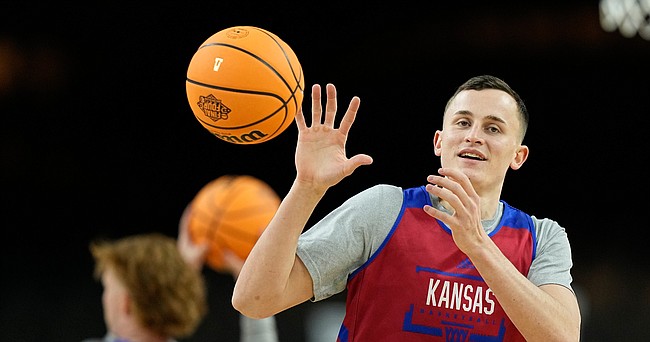Kansas forward Mitch Lightfoot warms during practice for the men's Final Four NCAA college basketball tournament, Friday, April 1, 2022, in New Orleans.