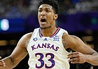 Kansas forward David McCormack celebrates after scoring against Villanova during the first half of a college basketball game in the semifinal round of the Men's Final Four NCAA tournament, Saturday, April 2, 2022, in New Orleans.