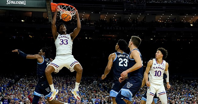 Kansas' David McCormack (33) dunks the ball against Villanova's Brandon Slater, left, defends during the second half of a college basketball game in the semifinal round of the Men's Final Four NCAA tournament, Saturday, April 2, 2022, in New Orleans. (AP Photo/Brynn Anderson)


