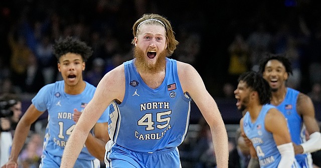 North Carolina's Brady Manek (45) celebrates after beating Duke in a college basketball game during the semifinal round of the Men's Final Four NCAA tournament, Saturday, April 2, 2022, in New Orleans. (AP Photo/David J. Phillip)