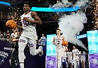 Kansas' Ochai Agbaji (30) leads teammates onto the court for a college basketball game against Villanova in the semifinal round of the Men's Final Four NCAA tournament, Saturday, April 2, 2022, in New Orleans. (AP Photo/Brynn Anderson)