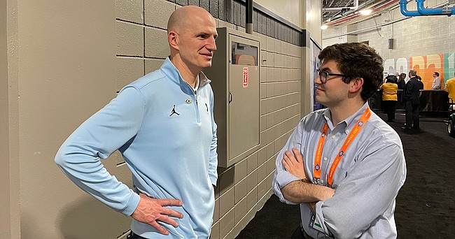 North Carolina assistant coach Brad Frederick, left, talks with a reporter outside of the UNC locker room after the Tar Heels' 81-77 win over Duke in the national semifinals on Saturday, April 2, 2022 in New Orleans. The win pits Frederick, a 1995 Lawrence High graduate, against the team he grew up loving, in Kansas, on Monday night for the national title. 