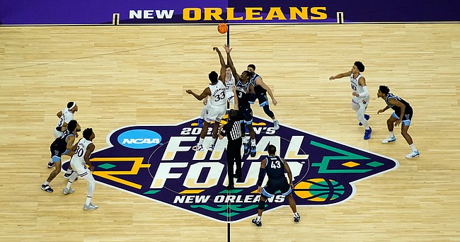 Villanova and Kansas tip off their college basketball game during the semifinal round of the Men's Final Four NCAA tournament, Saturday, April 2, 2022, in New Orleans. (AP Photo/David J. Phillip)