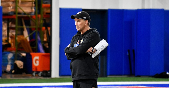 Kansas football coach Lance Leipold observes a practice at the indoor football fields on March 29, 2022.