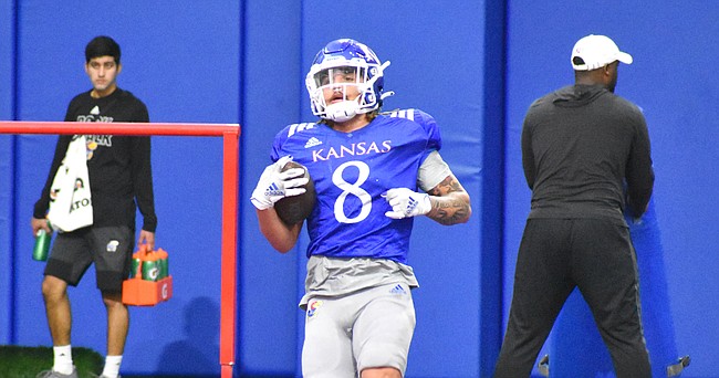 Kansas running back Ky Thomas participates in a drill at the indoor practice facility on March 29, 2022.