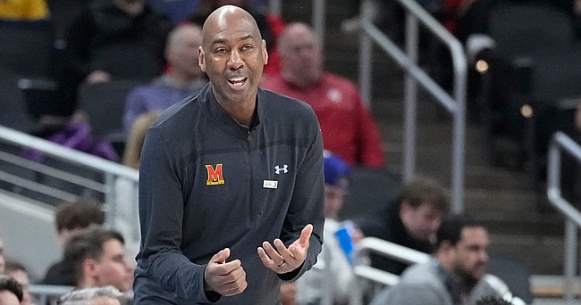 Maryland head interim head coach Danny Manning questions a call during the first half of an NCAA college basketball game against Michigan State at the Big Ten Conference tournament, Thursday, March 10, 2022, in Indianapolis. (AP Photo/Darron Cummings)
