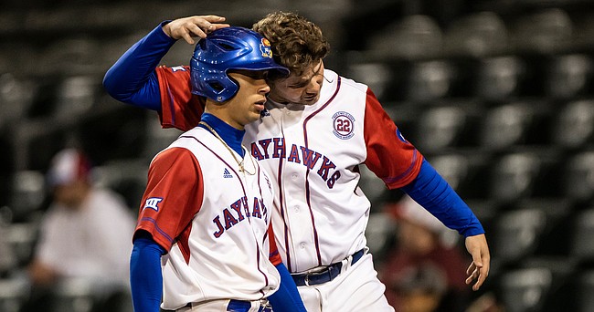 Kansas second baseman Tavian Josenberger, left, and first baseman Cooper McMurray celebrate during the game against Texas Southern at Legends Field on April 19, 2022.