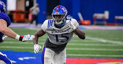 Kansas' Kyron Johnson participates in team drills during a spring practice on April 8, 2021.
